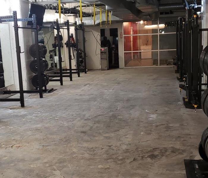 Photo of a gym with no flooring.