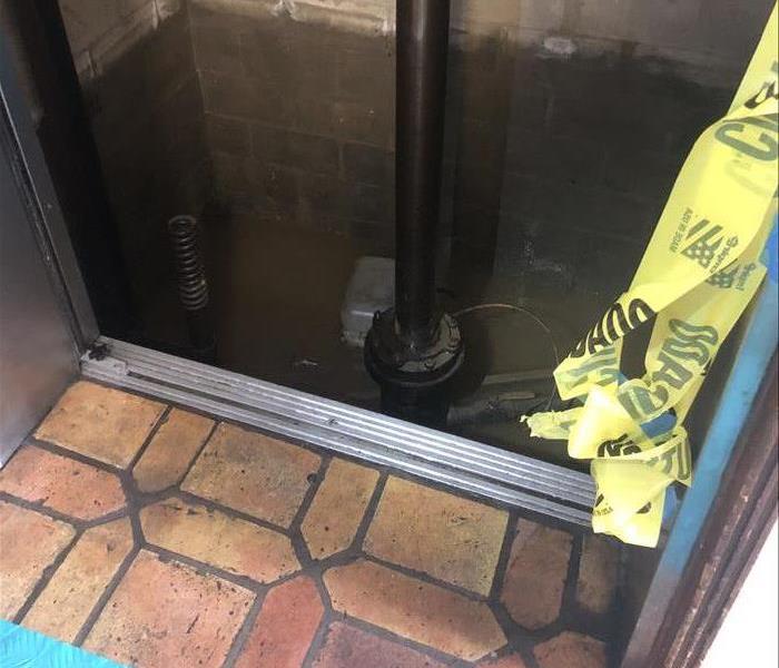A photo of water in an elevator shaft.