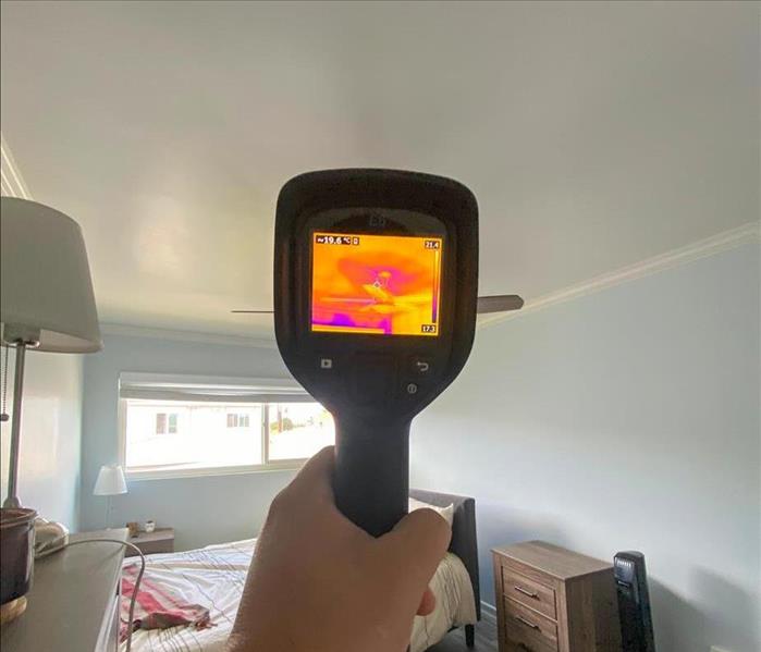 SERVPRO tech checking for moisture in a home in Centre City San Diego