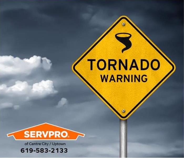 A tornado warning sign is visible.