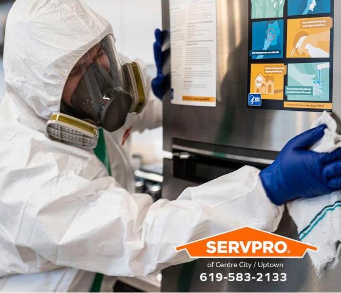 SERVPRO technicians decontaminate a breakroom in a workplace.