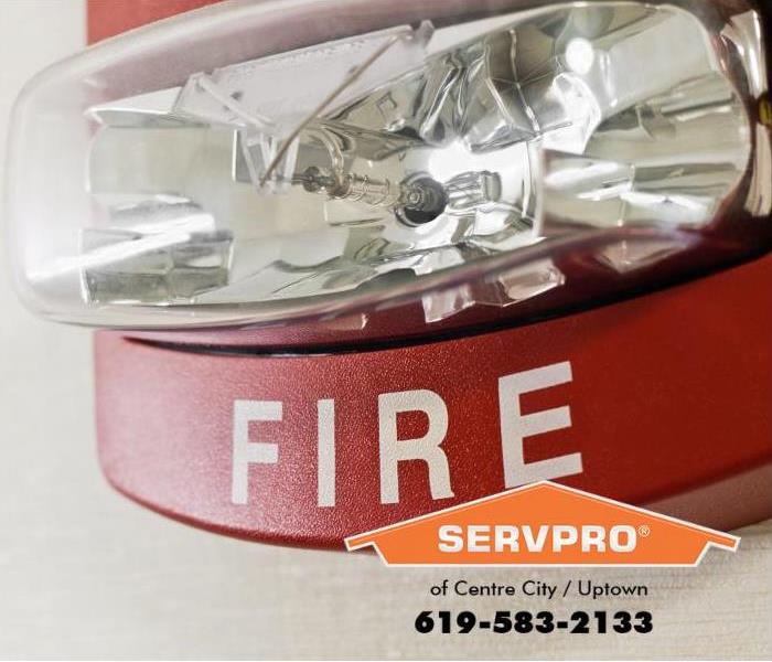 A fire alarm with a strobe light attached is featured.